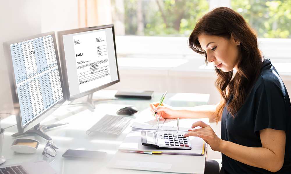 a female working on bookkeeping services sitting in front of pc